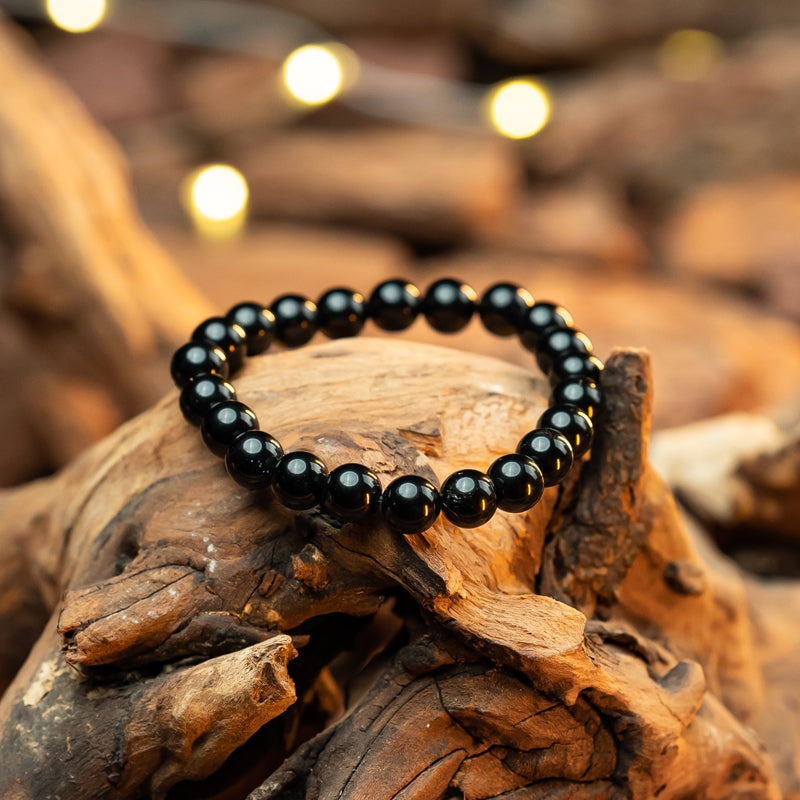 "Guardian Shadows: The Protective Embrace of a Black Obsidian Bracelet"