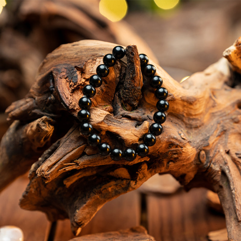 "Guardian Shadows: The Protective Embrace of a Black Obsidian Bracelet"