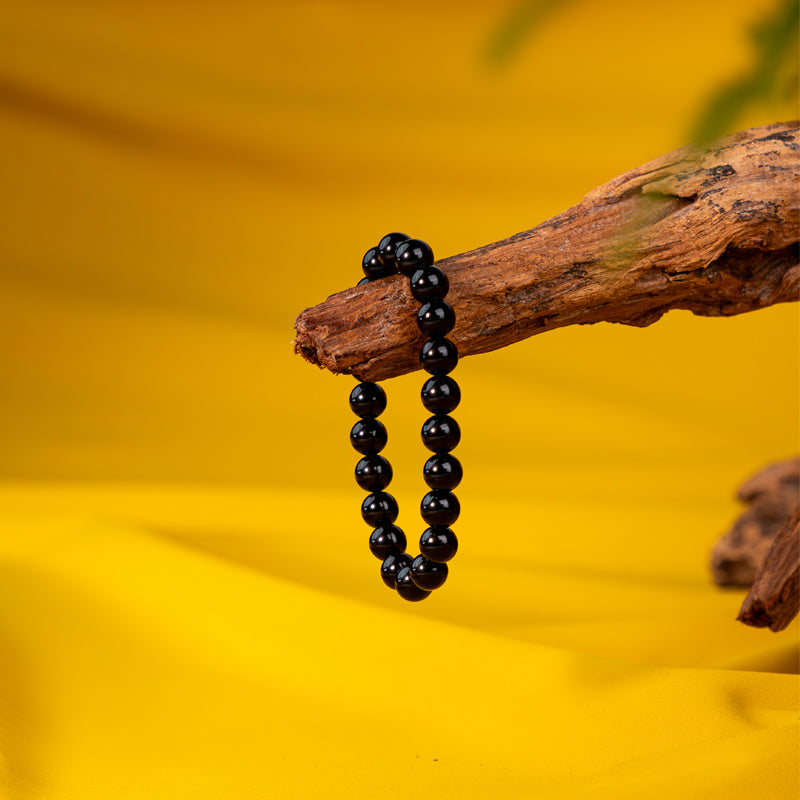 "Guardian Shadows: The Protective Embrace of a Black Obsidian Bracelet"