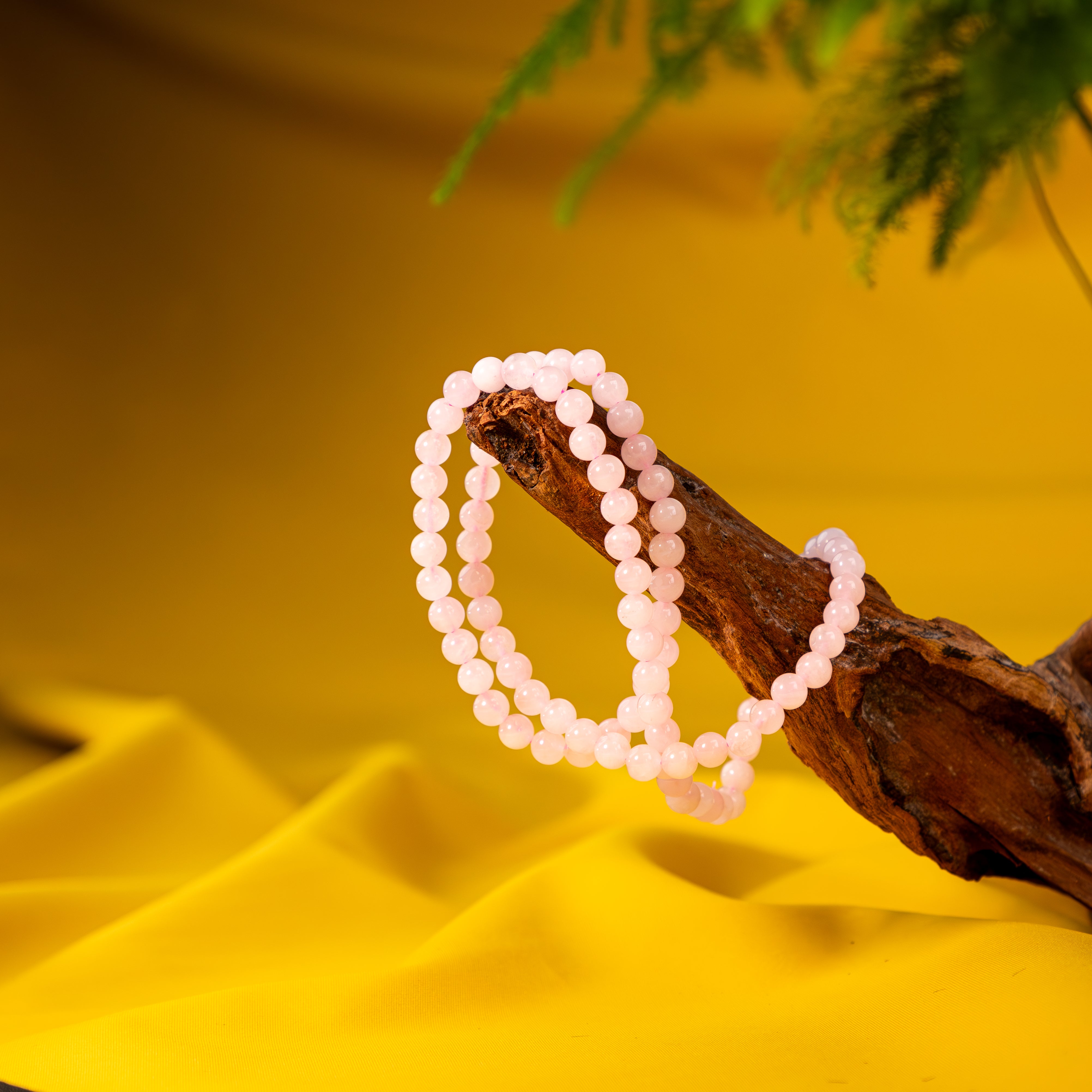 Tripled Radiance: Triple Wrap Rose Quartz Bracelet