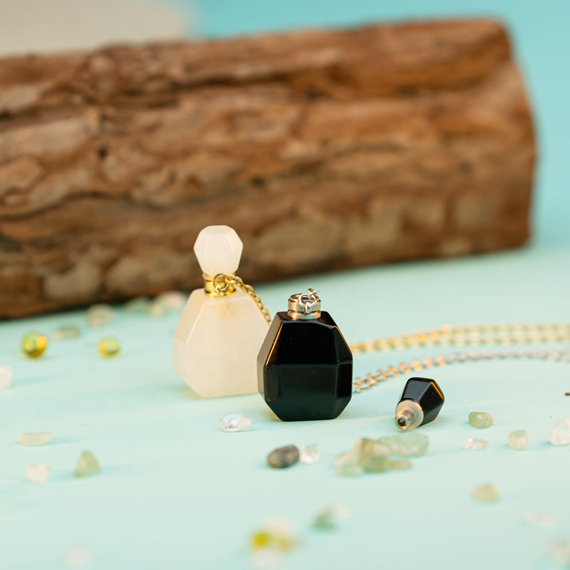 "Harmonizing Energies: The Black Obsidian and Clear Quartz Essential Oil Bottle Pendant"