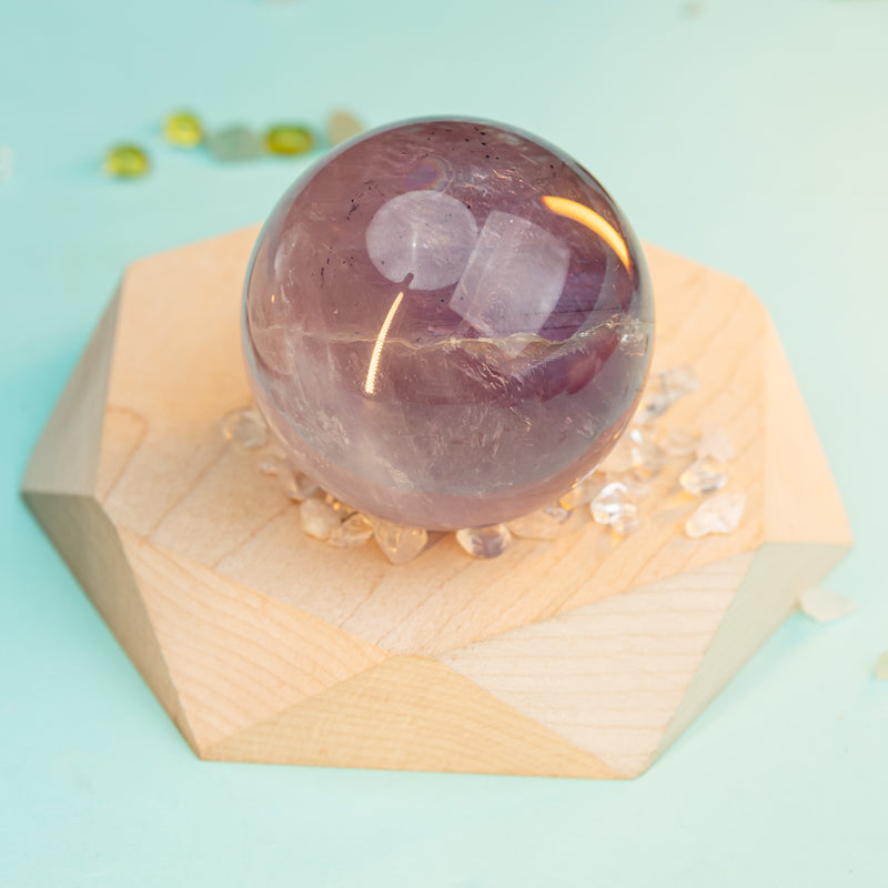 "Sphere of Serenity: Unlocking the Mystical Powers of Amethyst Spheres"