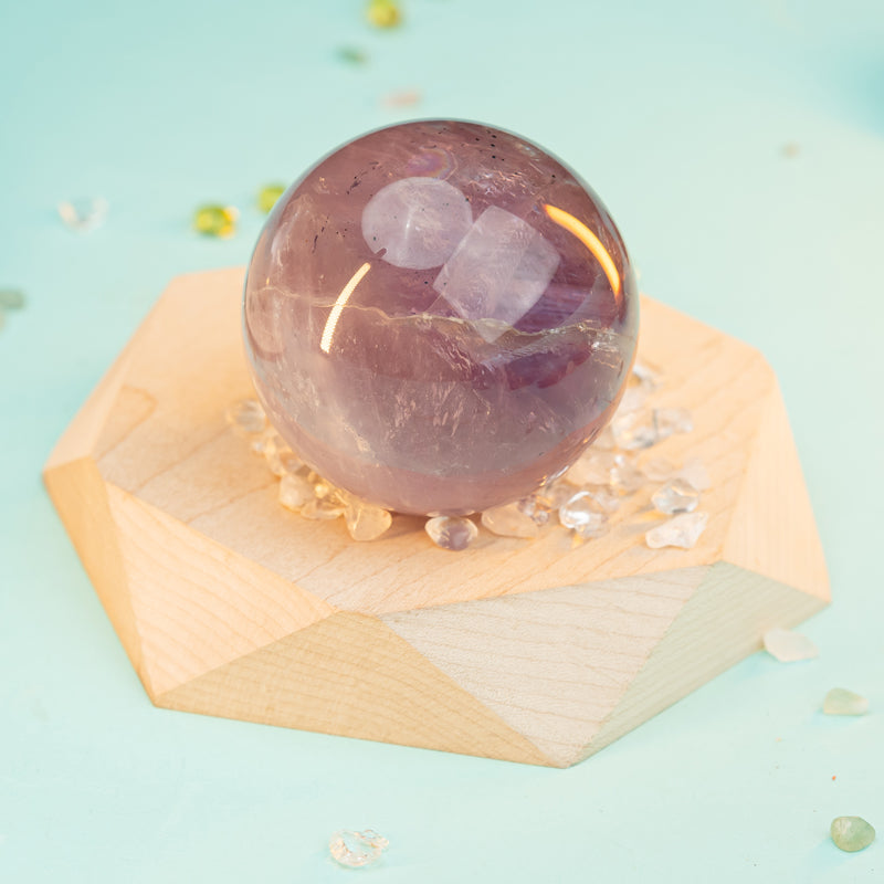 "Sphere of Serenity: Unlocking the Mystical Powers of Amethyst Spheres"