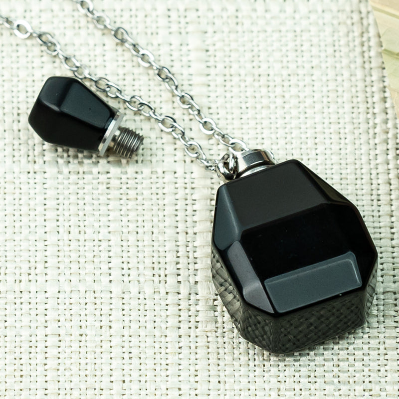 "Harmonizing Energies: The Black Obsidian and Clear Quartz Essential Oil Bottle Pendant"