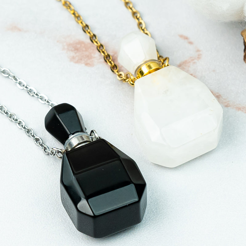 "Harmonizing Energies: The Black Obsidian and Clear Quartz Essential Oil Bottle Pendant"