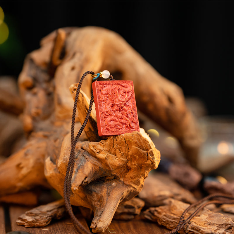 "Artisan's Legacy: The Hand-Carved Cinnabar Dragon Amulet Pendant"