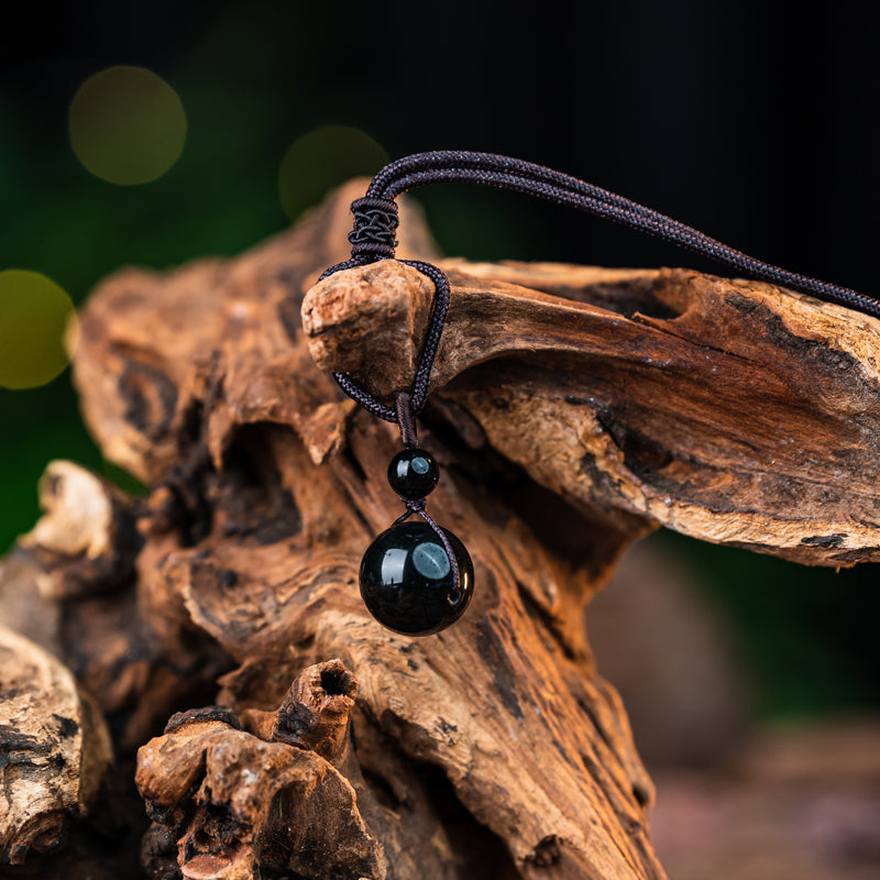 "Obsidian Bead Pendant: Symbol of Protection, Balance, and Inner Strength"