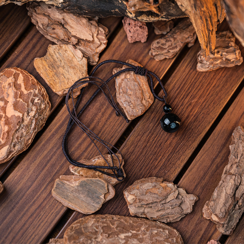 "Obsidian Bead Pendant: Symbol of Protection, Balance, and Inner Strength"