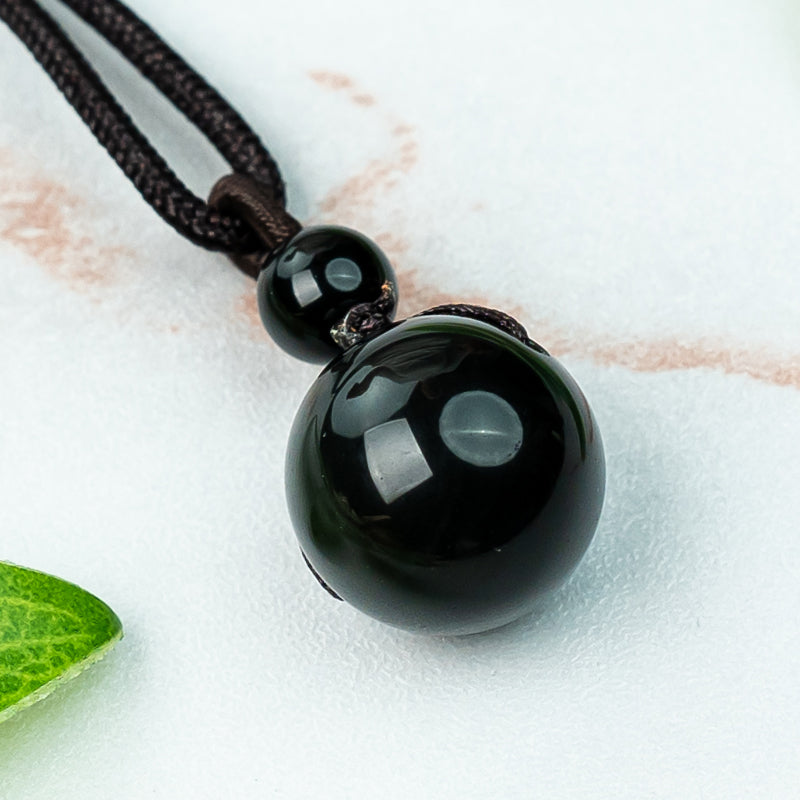 "Obsidian Bead Pendant: Symbol of Protection, Balance, and Inner Strength"