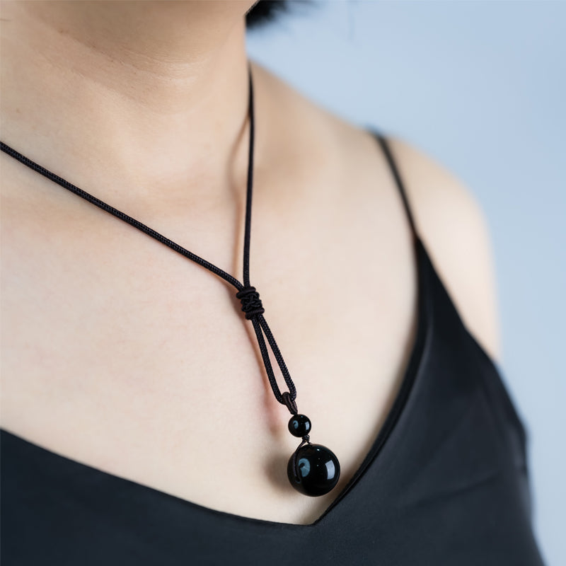 "Obsidian Bead Pendant: Symbol of Protection, Balance, and Inner Strength"