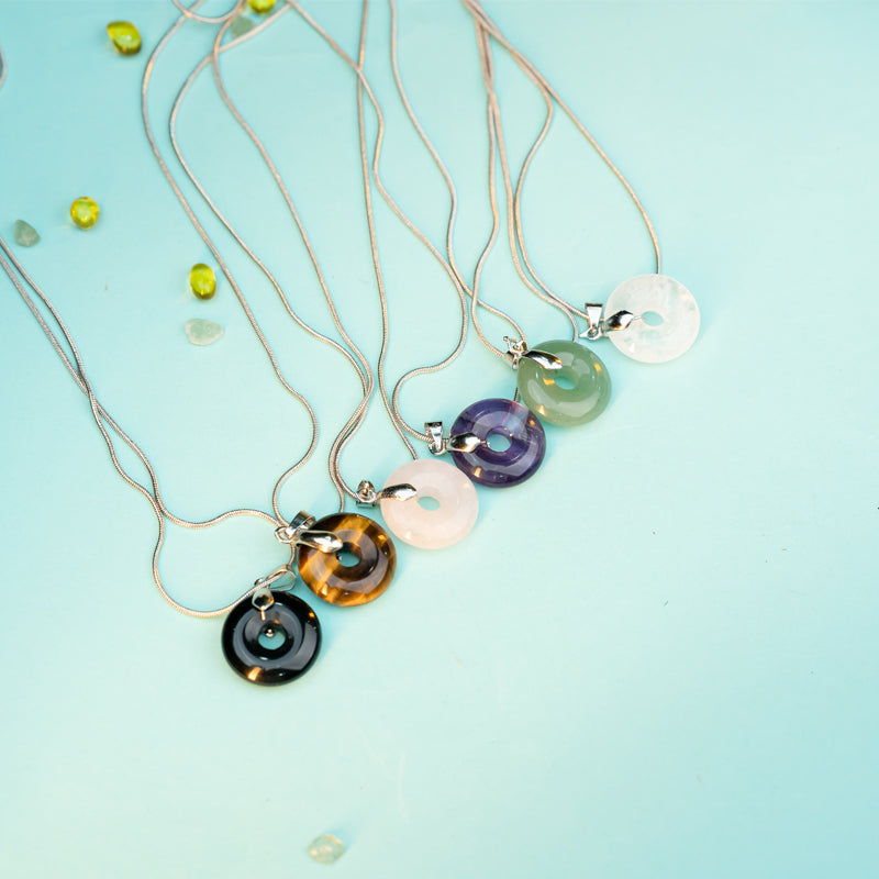 "Crystals of Affinity: Gemstone Necklaces for Personal Growth and Zodiac Harmony"