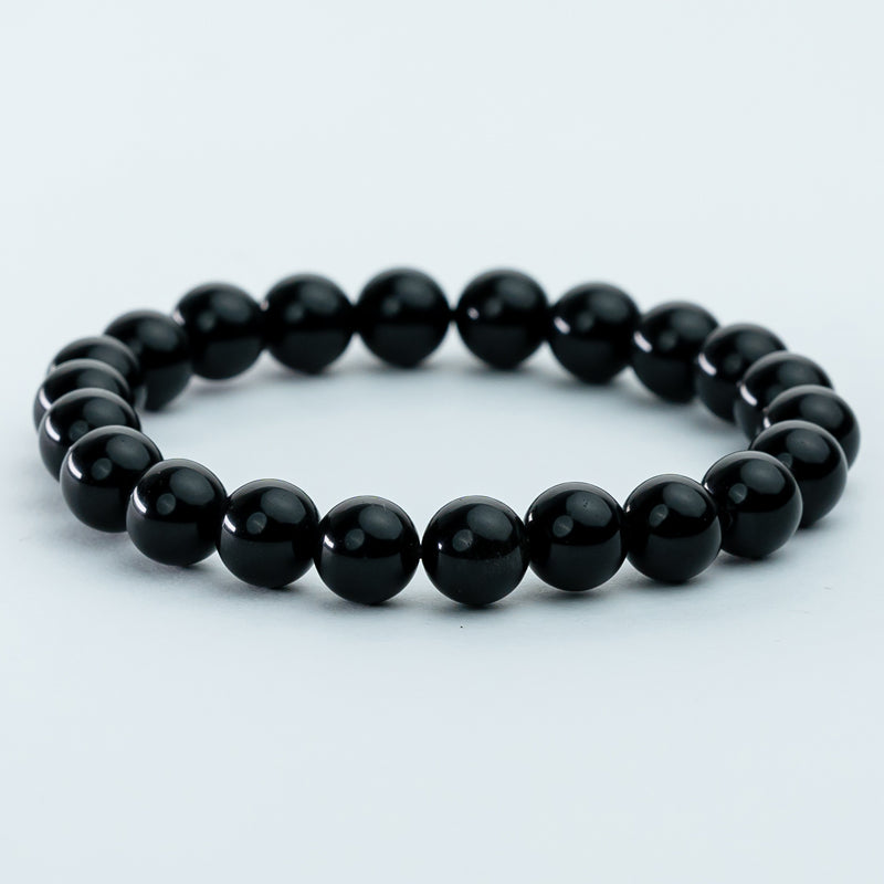 "Guardian Shadows: The Protective Embrace of a Black Obsidian Bracelet"