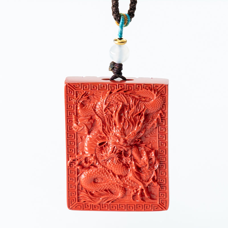 "Artisan's Legacy: The Hand-Carved Cinnabar Dragon Amulet Pendant"