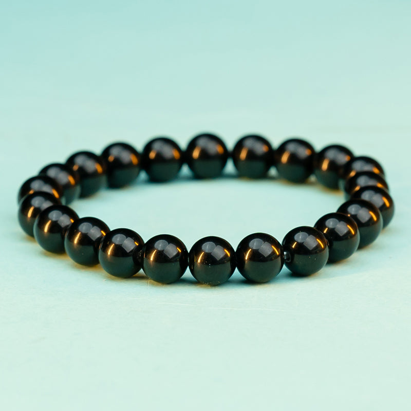 "Guardian Shadows: The Protective Embrace of a Black Obsidian Bracelet"