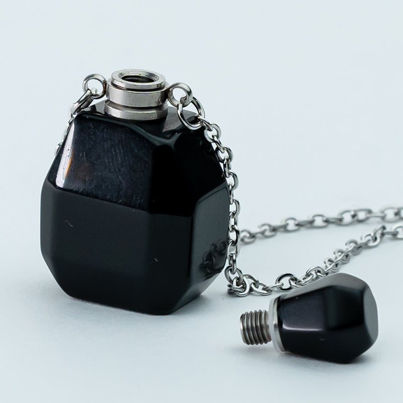 "Harmonizing Energies: The Black Obsidian and Clear Quartz Essential Oil Bottle Pendant"