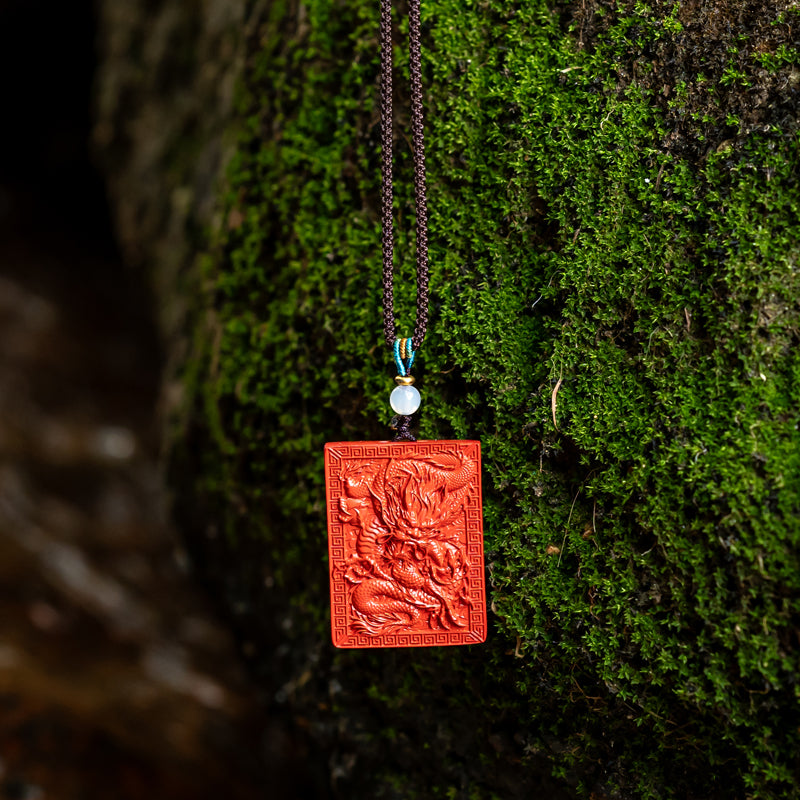 "Artisan's Legacy: The Hand-Carved Cinnabar Dragon Amulet Pendant"