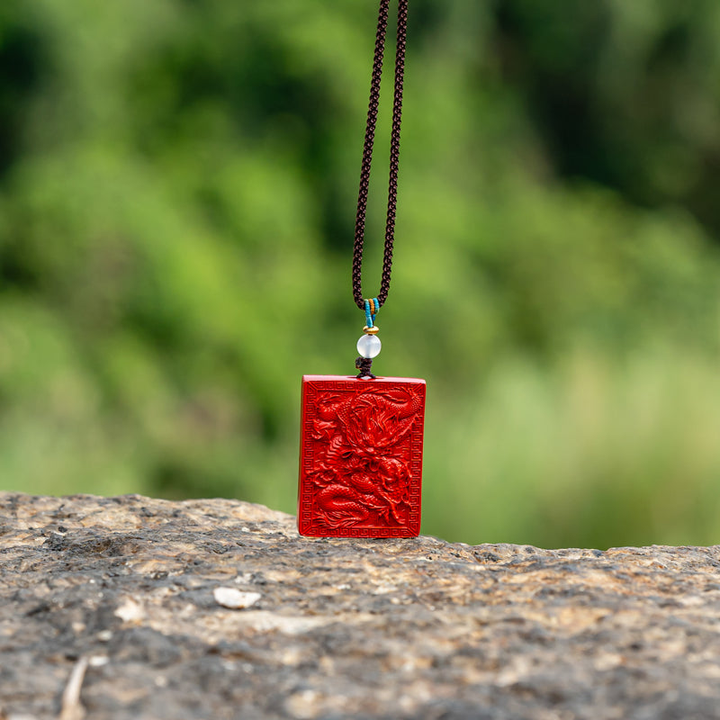 "Artisan's Legacy: The Hand-Carved Cinnabar Dragon Amulet Pendant"